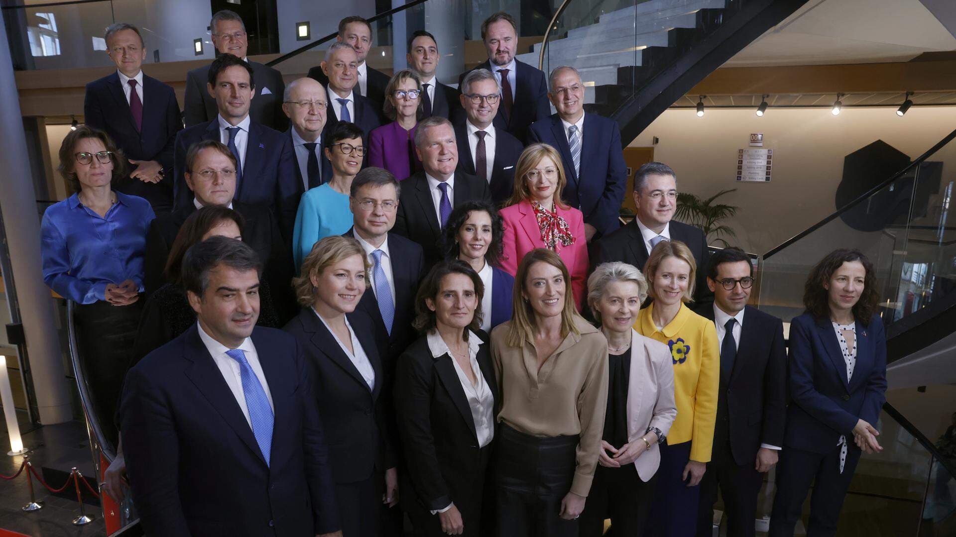 European Commission President Ursula von der Leyen, front center right, and European Parliament President Roberta Metsola, front center left, pose with the new EU College of Commissioners.