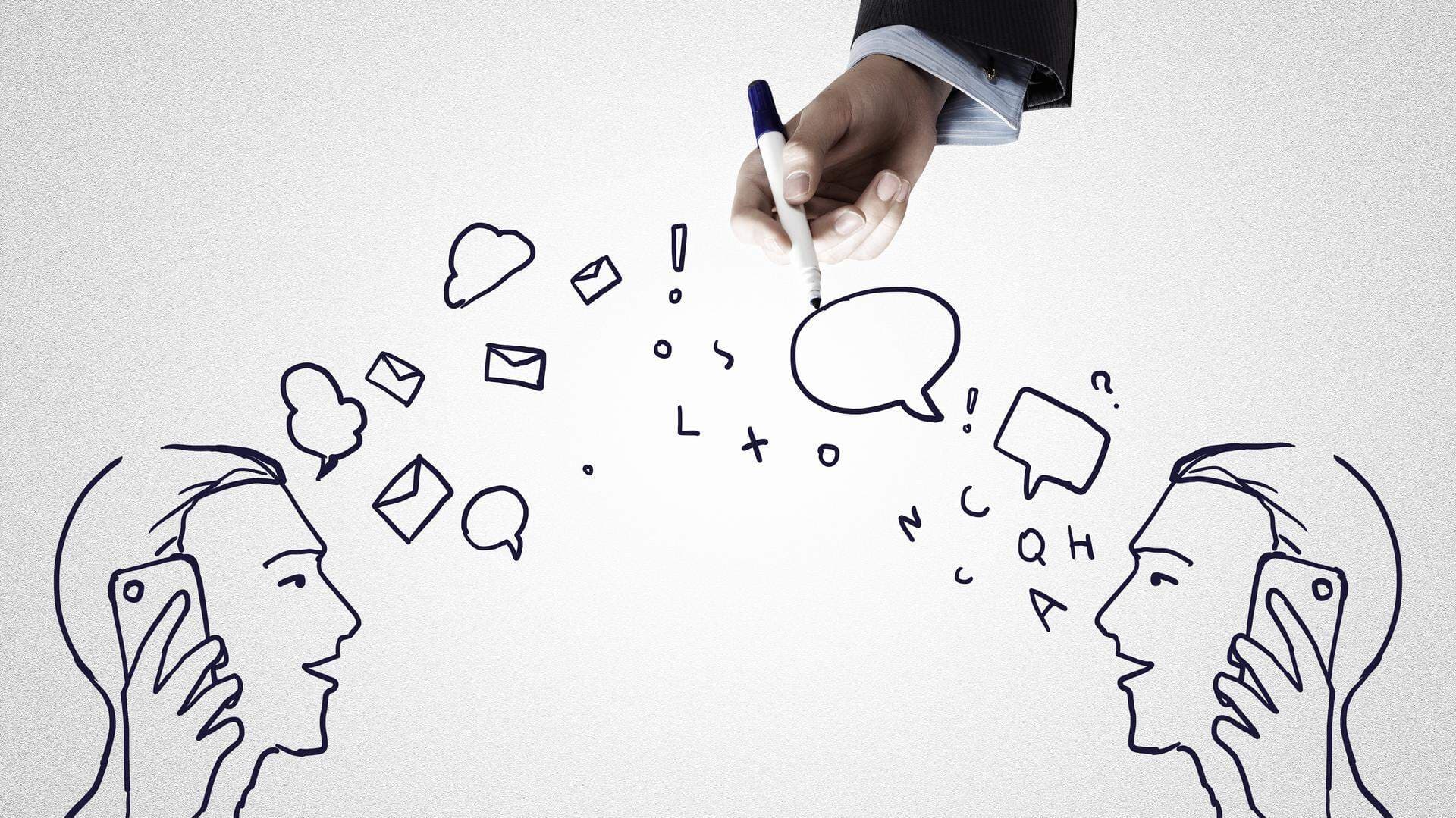 En hand som håller i en penna och har tecknat en bild av två personer som har en dialog